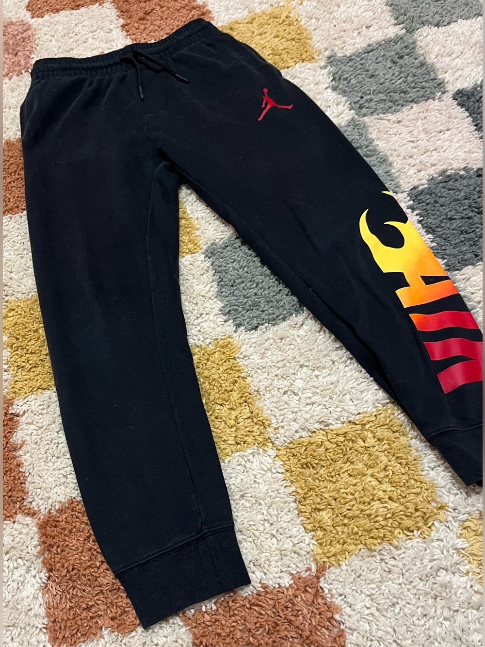 Jordan Youth Black Sweatpants with Red Jumpman and Yellow-Orange Flame Graphic